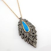 Leaf necklace detailed with turquoise and 1.59 ct brilliant diamonds and 18K gold on silver