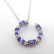 14K White gold necklace detailed with tanzanite and brilliant diamonds