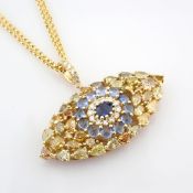14K large evil eye necklace detailed with vibrant sapphire and brilliant diamonds