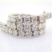 14K white gold tennis bracelet detailed with brilliant diamonds