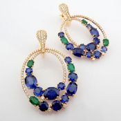 18K rose gold earrings detailed with vibrant emerald, sapphire and brilliant diamonds