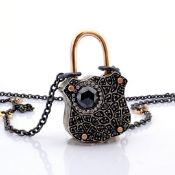 An exquisite, convertible clasp necklace embellished with gold and diamonds on silver