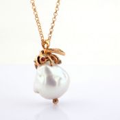 An exquisite bee necklace detailed with baroque pearl , brilliant diamonds and gold