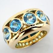 14K yellow gold ring detailed with 5.98 ct blue topaz