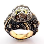Hand-made gold & silver ring. Detailed with topaz, reversely engraved intaglio owl and diamonds