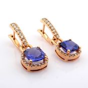 18K rose gold earrings detailed with tanzanite and brilliant diamonds