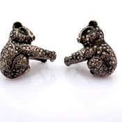 Hand-made panda earrings detailed with brilliant diamonds and gold on silver
