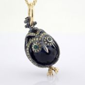 An exquisite owl necklace detailed with brilliant diamonds and gold on silver.