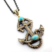 An exquisite anchor necklace detailed with turquoise, brilliant diamonds and gold on silver.