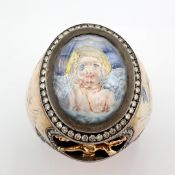 Handmade ring with topaz, with a reverse-engraved intaglio of an angel with micro-art and diamond...