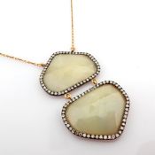 Gold necklace with fancy cut rough Sapphire and brilliant diamonds on silver frame