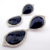 18K white gold earrings detailed with slice cut rough sapphire and brilliant diamonds on frame