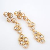 18K rose and white gold earrings detailed with brilliant diamonds