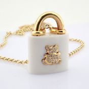 An exquisite necklace made of 14K yellow gold and Onyx stone and detailed with diamonds