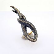 An exquisite feather ring detailed with brilliant diamonds and gold on silver.