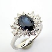 18K white gold cluster ring detailed with sapphire and diamonds