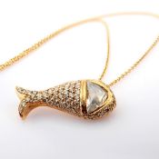 18K fish necklace detailed with fancy cut a slightly flawed triangle diamond and brilliant Diamond..