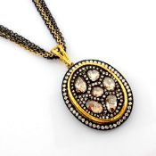 An exquisite necklace intricately detailed with .brilliant diamonds and gold in silver