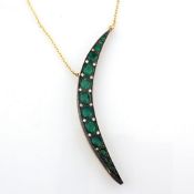 14K yellow gold moon necklace detailed with vibrant Emerald and brilliant diamonds