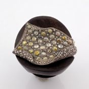 An exquisite ebony ring detailed with brilliant diamonds and silver.