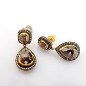 24K yellow gold earrings with slice cut rough diamond centre and brilliant diamonds on silver frame.
