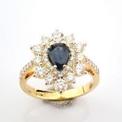 An exquisite 18k yellow gold ring detailed with sapphire and brilliant diamonds