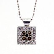 An exquisite necklace detailed with brown and white brilliant diamonds