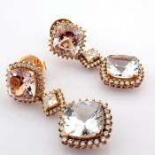 An exquisite earrings detailed with morganite, aquamarine, brilliant diamonds and gold