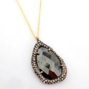 18K yellow gold necklace, slice cut rough diamond in the centre, brilliant diamonds on silver frame.