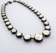 An exquisite necklace detailed with fancy cut topaz and gold in silver