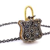 An exquisite, convertible clasp necklace embellished with gold and diamonds on silver