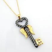 18K key necklace detailed with brilliant diamonds