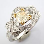 An exquisite 18k ring with one big fancy diamond detailed brilliant diamonds total 1.55 ct