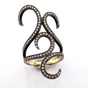 An exquisite ring detailed with brilliant diamonds and gold on silver.