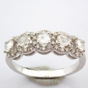 An exquisite 18K white gold ring detailed with fancy and brilliant cut diamonds