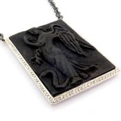 Carved angel necklace detailed with brilliant diamonds and 18K gold on silver.
