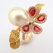 An exquisite 18k gold ring detailed with orange sapphire, pearl and brilliant diamonds
