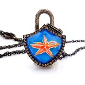 Convertible clasp necklace with gold and topaz, reversely engraved starfish and diamonds on silver..