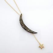 An exquisite Carrie's moon necklace detailed with brilliant diamonds and gold on silver.