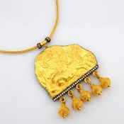 A mythological scene intricately engraved in 24K gold, adorned with silver accents and diamonds