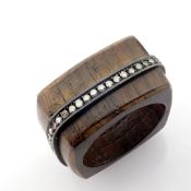 Ebony ring detailed with brilliant diamonds and silver