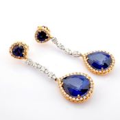 An exquisite cluster earrings detailed with sapphire, brilliant diamonds and gold