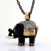 An ebony-carved elephant necklace intricately detailed with brilliant diamonds and gold on silver...