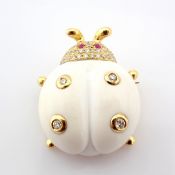 An exquisite agate ladybird pendant or brooch detailed with brilliant diamonds and gold