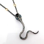 Snake necklace intricately detailed with 1.09 ct brilliant diamonds and 18K gold on silver