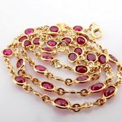 18K rose gold necklace detailed with rubies and brilliant diamonds
