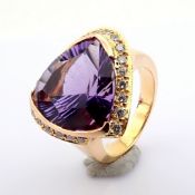 An exquisite 18K cluster ring detailed with amethyst and brilliant diamonds