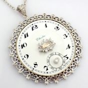 An exquisite necklace made of gold and silver, featuring an antique watch dial with diamonds