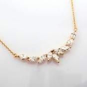 An exquisite necklace detailed with brilliant diamonds and gold