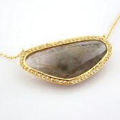 An exquisite necklace detailed with slice cut tourmaline, brilliant diamonds and gold